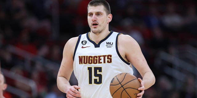 Denver Nuggets center Nikola Jokic (15) brings the ball up the court during the third quarter against the Houston Rockets at Toyota Center in Houston Feb 28, 2023.