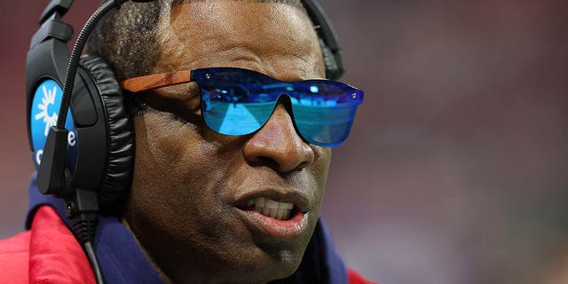 Head coach Deion Sanders of the Jackson State Tigers looks on against the North Carolina Central Eagles during the first half of the Cricket Celebration Bowl at Mercedes-Benz Stadium on December 17, 2022 in Atlanta, Georgia.