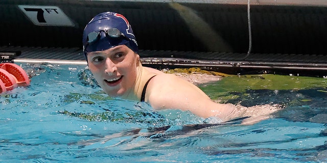 Pennsylvania's Lia Thomas smiles after winning the 100-yard freestyle final at the Ivy League women's swimming and diving championships at Harvard University, Feb. 19, 2022, in Cambridge, Massachusetts.