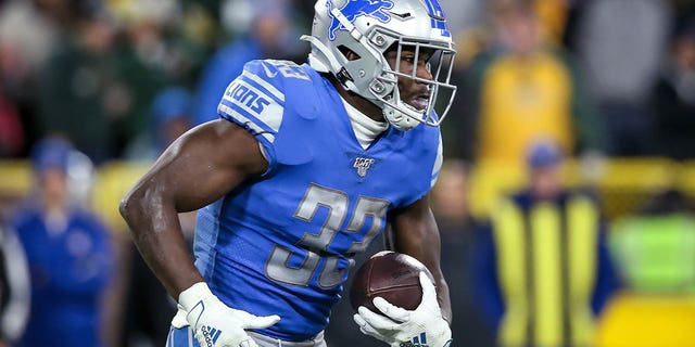 Kerryon Johnson, #33 of the Detroit Lions, runs with the ball in the second quarter against the Green Bay Packers at Lambeau Field on Oct. 14, 2019 in Green Bay, Wisconsin.