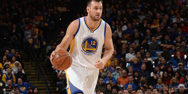 Andrew Bogut #12 of the Golden State Warriors dribbles the ball against the Milwaukee Bucks on December 18, 2015 at Oracle Arena in Oakland, California.