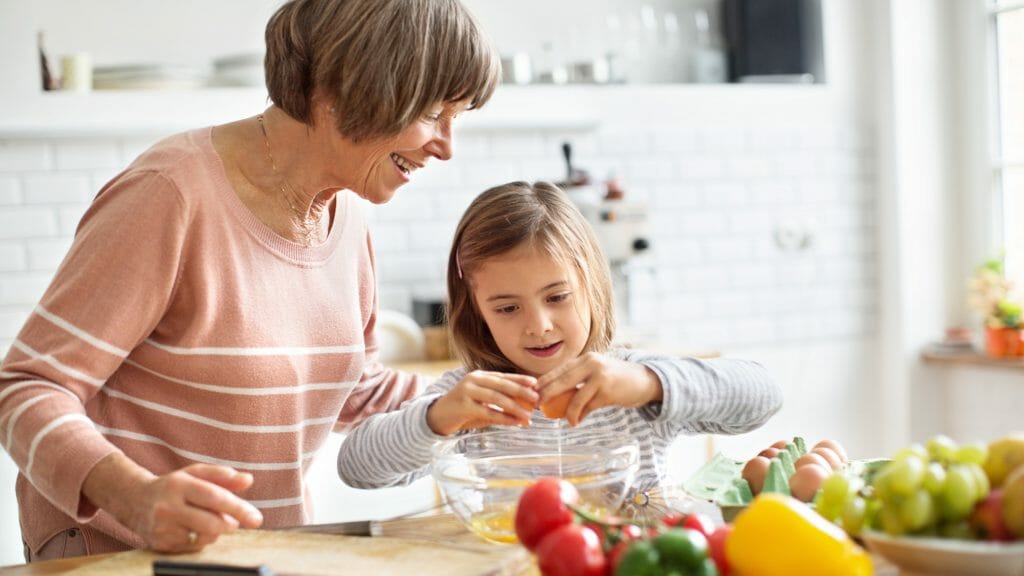 Grandmother baking with granddaughter