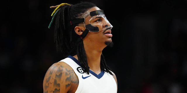 Mar 3, 2023; Denver, Colorado, USA; Memphis Grizzlies guard Ja Morant (12) looks on in the second quarter against the Denver Nuggets at Ball Arena.