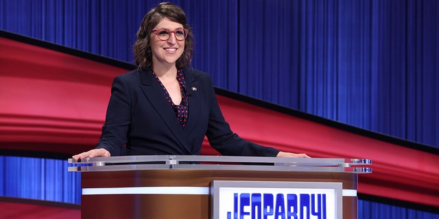 This image released by "Jeopardy!" shows Mayim Bialik hosting the game show Aug. 24, 2021.  