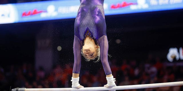 Olivia Dunne of LSU warms up on the uneven bars during a gymnastics meet against Auburn at Neville Arena on Feb. 10, 2023 in Auburn, Alabama.