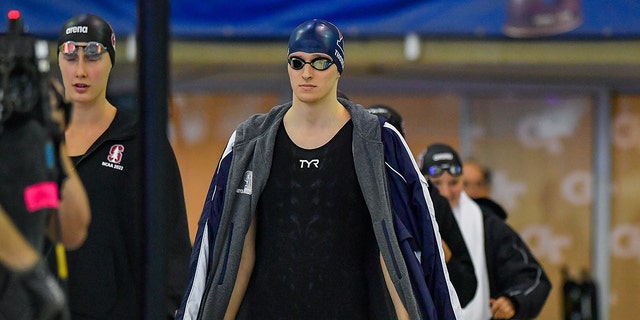 University of Pennsylvania swimmer Lia Thomas, center, enters for the 200 Freestyle final during the NCAA Swimming and Diving Championships at the McAuley Aquatic Center in Atlanta on March 18, 2022.