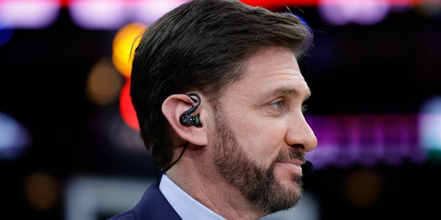 Mike Greenberg of ESPN looks on during a game between the Philadelphia 76ers and the Golden State Warriors at Wells Fargo Center on December 11, 2021 in Philadelphia, Pennsylvania.