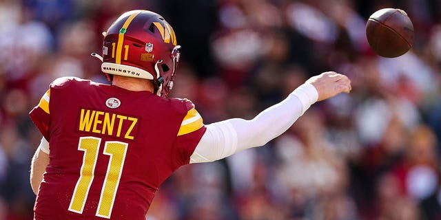 Carson Wentz of the Washington Commanders attempts a pass against the Cleveland Browns at FedExField on Jan. 1, 2023, in Landover, Maryland.