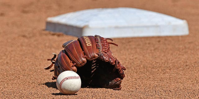 A ball and glove on the field before the College World Series on June 24, 2019, at TD Ameritrade Park in Omaha, Nebraska.