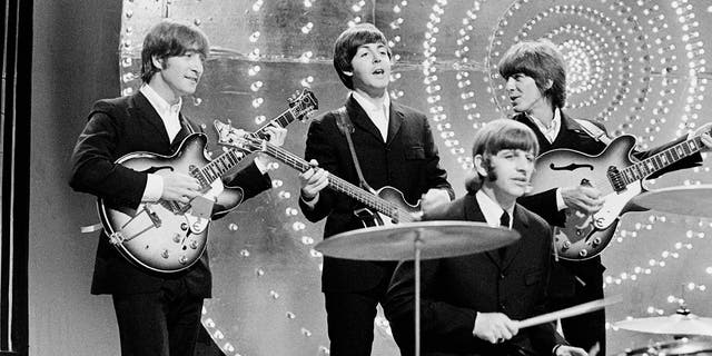 The Beatles perform "Rain" and "Paperback Writer" on BBC TV show "Top Of The Pops" in London June 16, 1966.