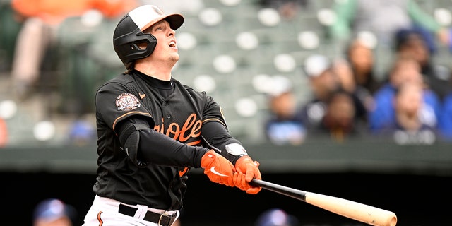 Adley Rutschman #35 of the Baltimore Orioles bats against the Toronto Blue Jays during game one of a doubleheader at Oriole Park at Camden Yards on October 05, 2022 in Baltimore, Maryland.