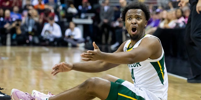 Baylor guard LJ Cryer reacts after losing possession of the ball during the Big 12 Tournament game between the Baylor Bears and the Iowa State Cyclones at the T-Mobile Center in Kansas City, Mo. on Thursday.