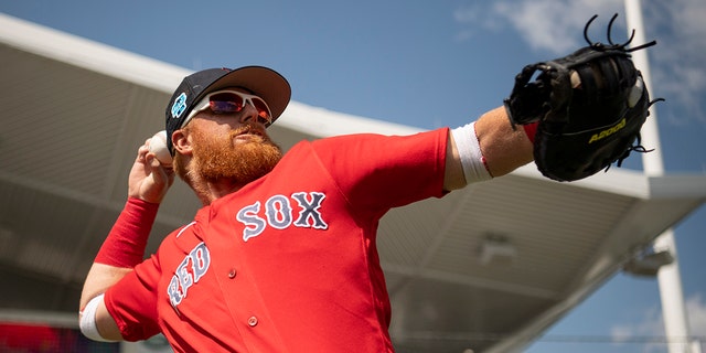 Justin Turner of the Boston Red Sox throws before a Grapefruit League game against the Detroit Tigers on March 6, 2023, at JetBlue Park at Fenway South in Fort Myers, Florida.