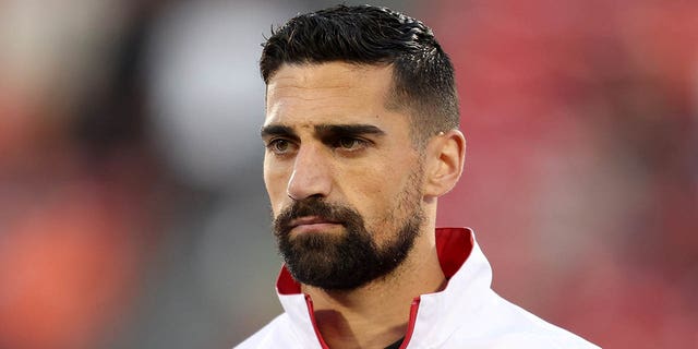 Sebastian Lletget #12 of FC Dallas stands for the national anthem before to the MLS game between Sporting Kansas City and FC Dallas at Toyota Stadium on March 18, 2023 in Frisco, Texas.