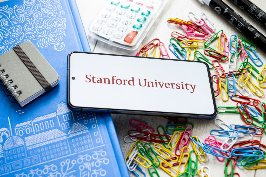 In this photo illustration a Stanford University logo seen...