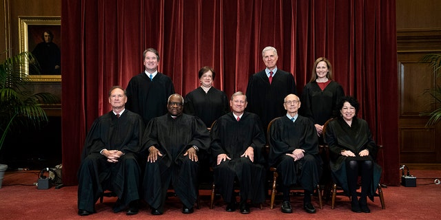 Seated from left to right, are Associate Justice Samuel Alito, Associate Justice Clarence Thomas, Chief Justice John Roberts, Associate Justice Stephen Breyer and Associate Justice Sonia Sotomayor, Standing from left to right are Associate Justice Brett Kavanaugh, Associate Justice Elena Kagan, Associate Justice Neil Gorsuch and Associate Justice Amy Coney Barrett.