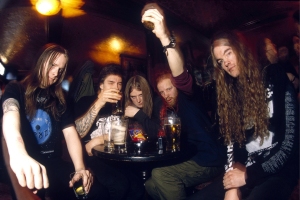 UNITED KINGDOM - JANUARY 01: Photo of Martin LARSSON and Tomas LINDBERG and Adrian ERLANDSSON and Anders BJORLER and AT THE GATES and Jonas BJORLER; Group portrait in the pub, drink L-R Anders Bjorler, Adrian Erlandsson, Jonas Bjorler . Tomas 'Tompa' Lindberg and Martin Larsson (Photo by Mick Hutson/Redferns)