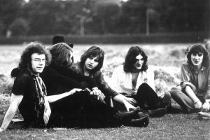 1969: (L-R) Guitarist Robert Fripp, drummer Michael Giles, singer and guitarist Greg Lake, multi-instrumental Ian McDonald and lyricist Peter Sinfield which consisted of the first lineup of the English rock band "King Crimson" pose for an Island Records publicity still sitting in a field in 1969. (Photo by Willie Christie/Michael Ochs Archives/Getty Images)