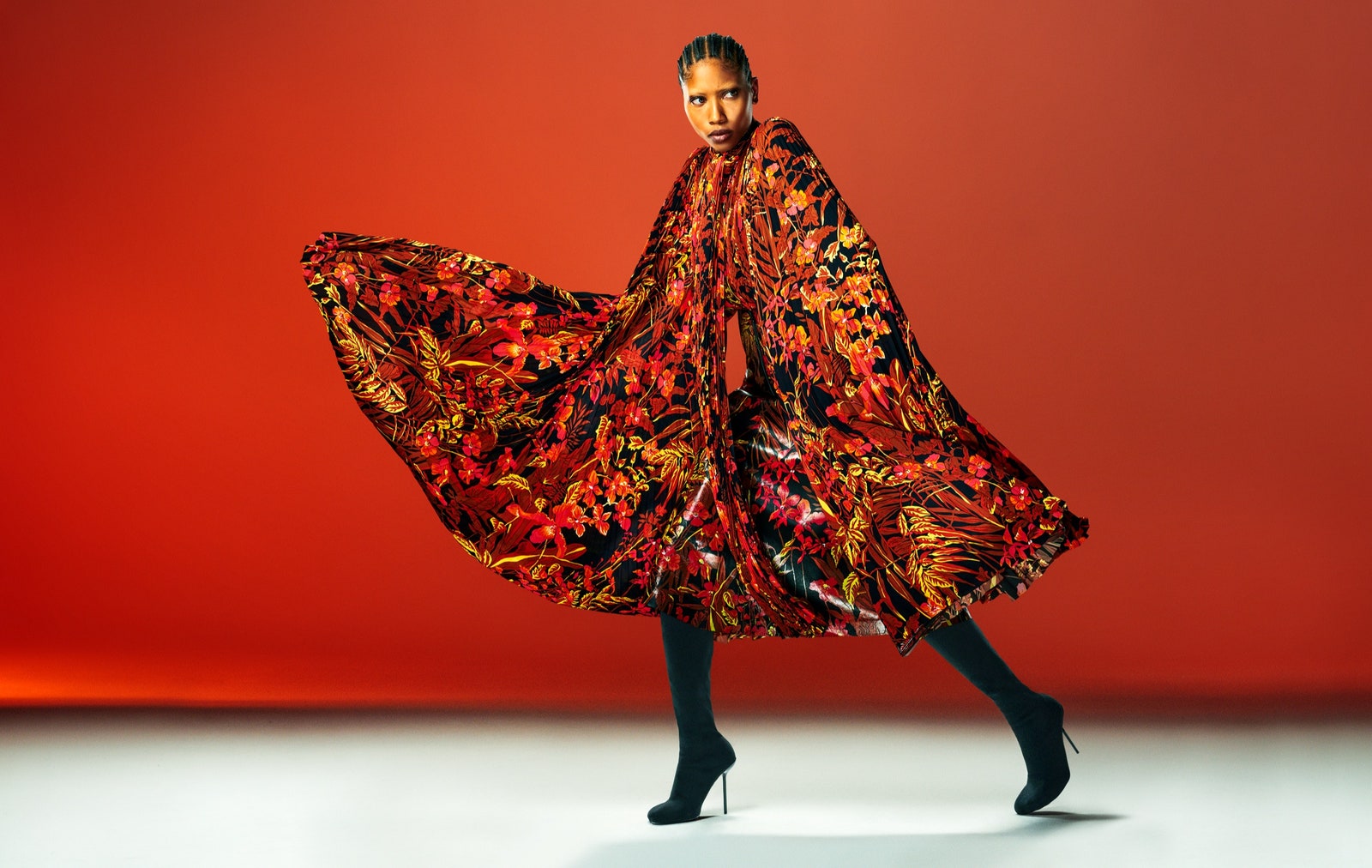 A model poses in a large floral dress.