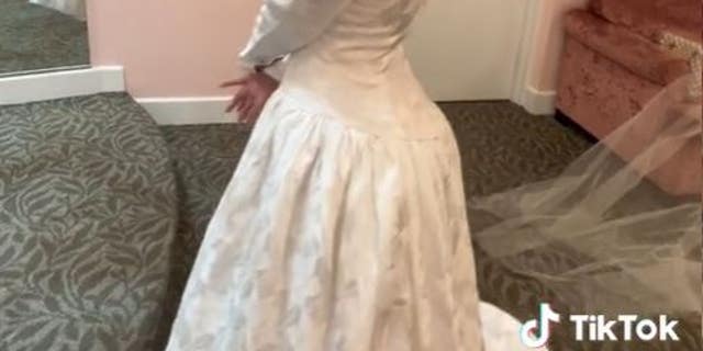 Williams is shown trying on her mother's long-sleeve wedding gown, which she later wore on her own wedding day. "I don't believe in a backup plan," she said of her lifestyle choice to focus solely on her husband. 