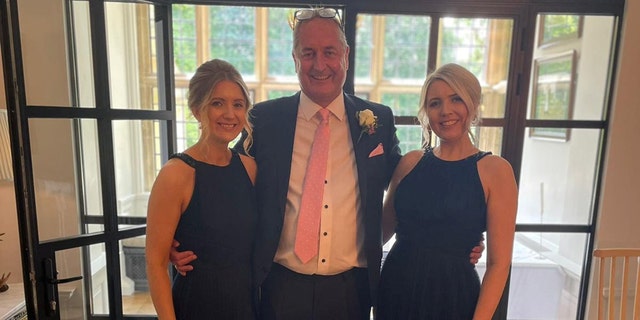 Gabriella Morby (left) with her sister and their father on his wedding day to their new stepmother in Cotswold.