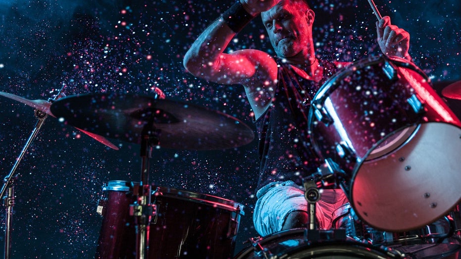 man playing drums