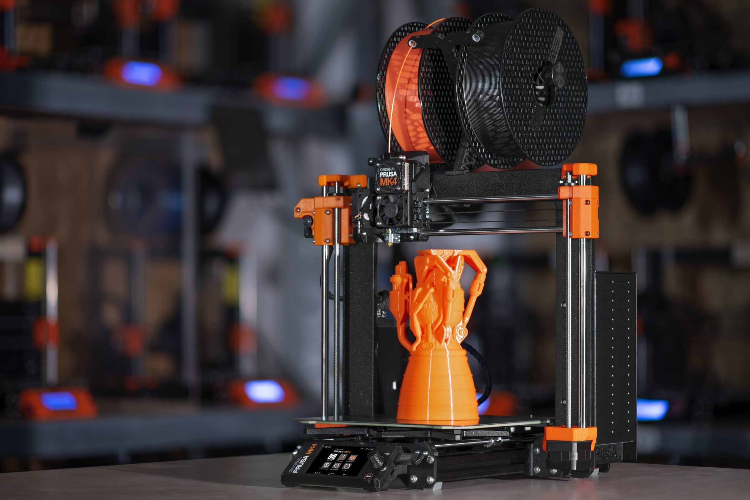 The Prusa MK4 has a new mainboard, firmware, quick-swap nozzles, load cell sensor for a “perfectly smooth first layer without user interaction,” LCD screen, more precise stepper motors, and more.