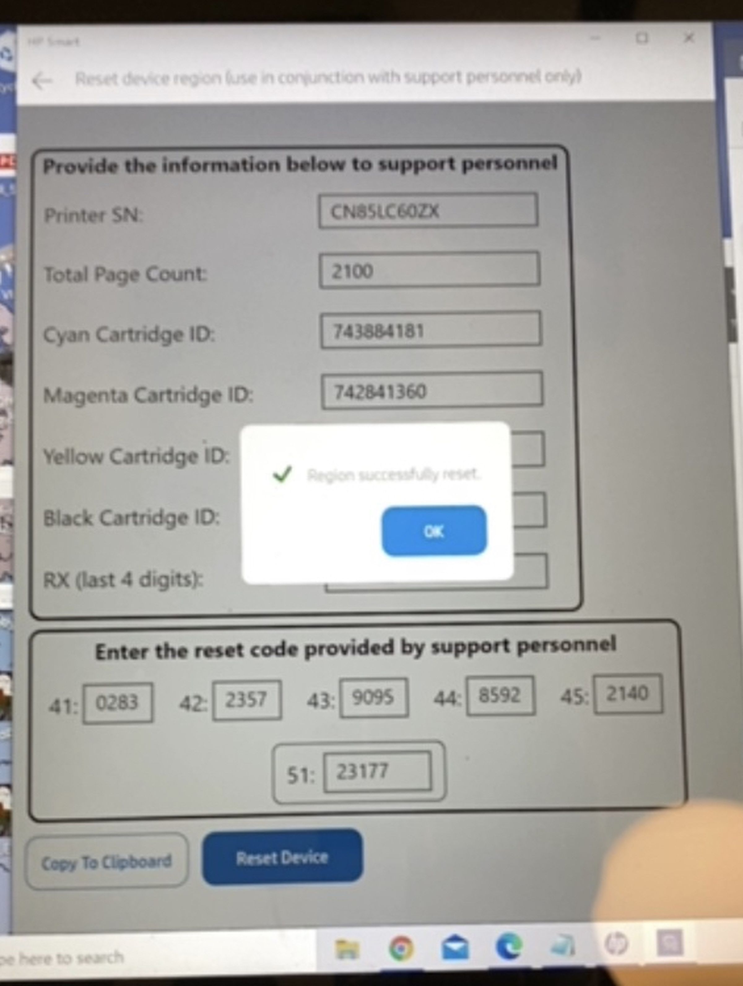 Screenshot of a phone video of a laptop screen showing “Region successfully reset.”