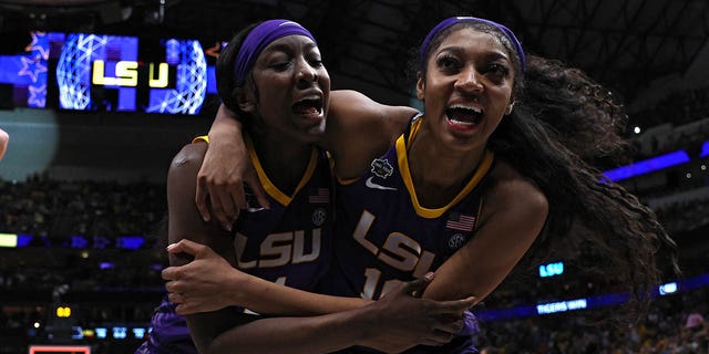 Angel Reese, #10, and Flau'jae Johnson, #4 of the LSU Lady Tigers, react after the 79-72 victory over the Virginia Tech Hokies during the 2023 NCAA Women's Basketball Tournament Final Four semifinal game at American Airlines Center on March 31, 2023, in Dallas, Texas. 