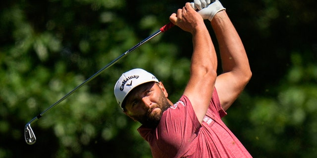 Jon Rahm, of Spain, watches his tee shot on the fourth hole during the final round of the Masters golf tournament at Augusta National Golf Club on Sunday, April 9, 2023, in Augusta, Ga.