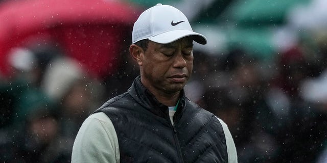 Tiger Woods walks on the 18th hole during the weather-delayed second round of the Masters on Saturday, April 8, 2023. 