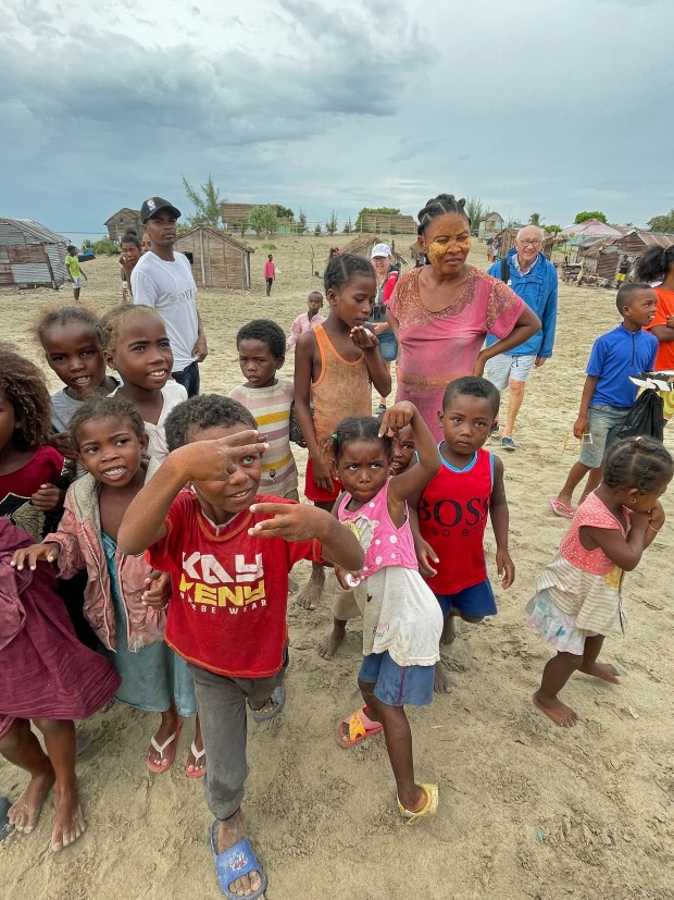 Vezo kids, unaccustomed to visitors in their small village, ham it up for a camera. (Photo by Norma Meyer)