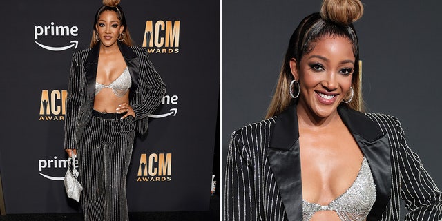 Mickey Guyton sports a rhinestone bikini top and black pinstripe suit at the ACM Awards