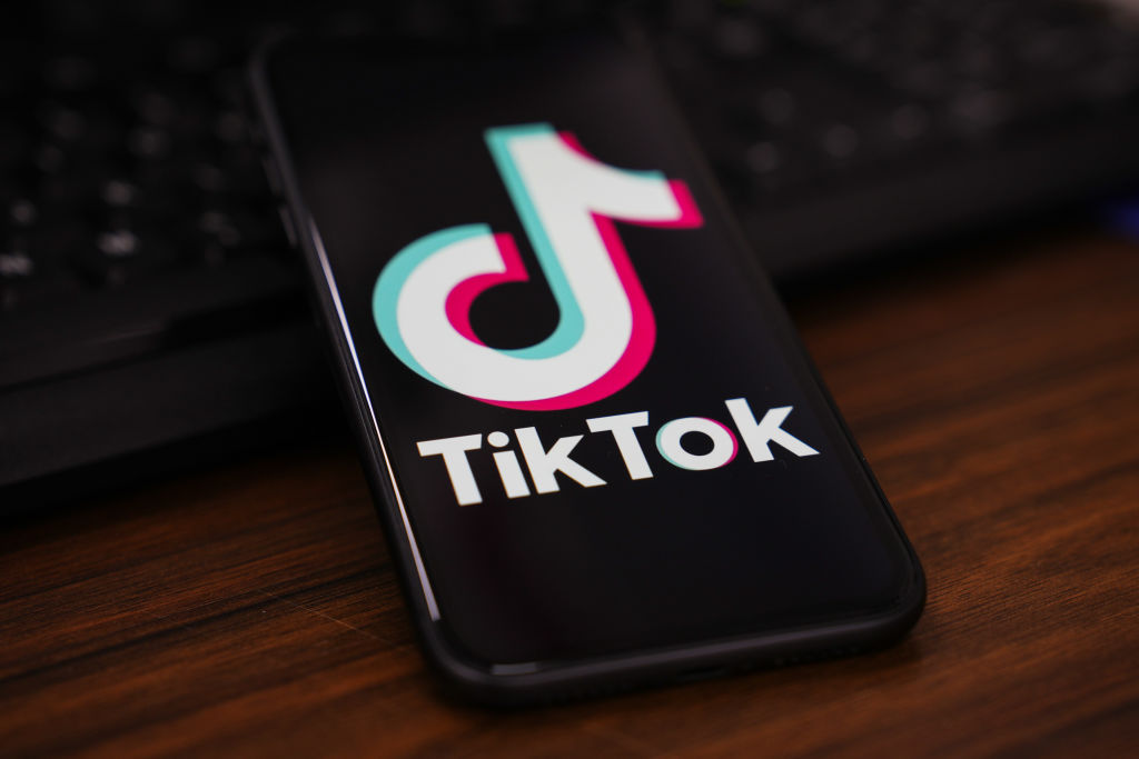 In this photo illustration, the TikTok logo is displayed on...