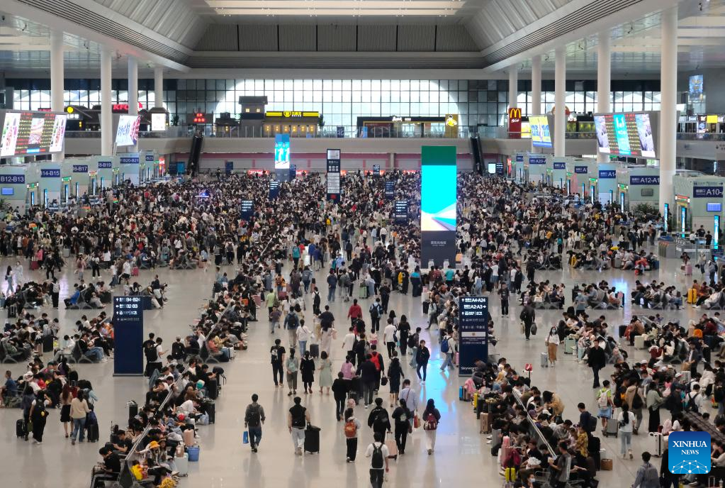 Passengers wait to board trains at Nanning East Railway Station in Nanning, south China's Guangxi Zhuang Autonomous Region, April 29, 2023. /Xinhua