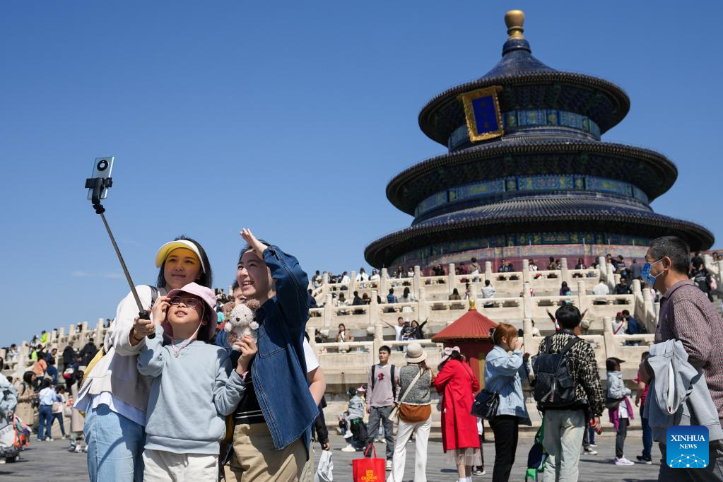 People take selfies at the Temple of Heaven in Beijing, capital of China, April 29, 2023. /Xinhua