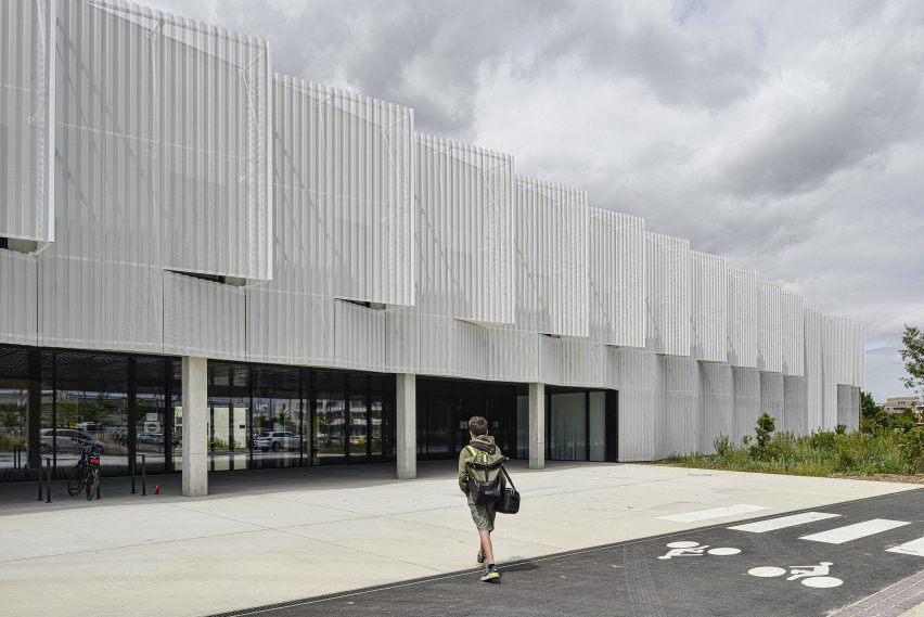 Photo of a person walking toward the facility