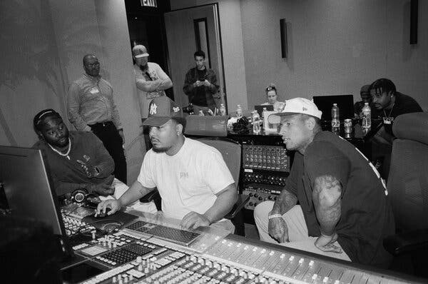 Darren Waller, second from right, looking on as Chibu Amajoyi (left), producer, and Dereck Burns, (center) audio engineer, worked on a song Waller wrote.