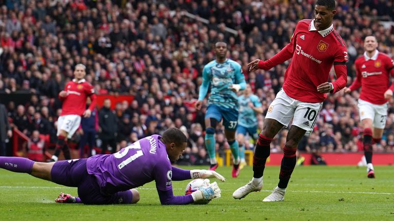 Southampton goalkeeper Gavin Bazunu saves from Manchester United&#39;s Marcus Rashford during the Premier League match at Old Trafford, Manchester. Picture date: Sunday March 12, 2023