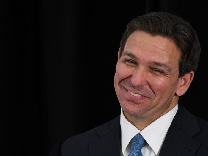 Florida Gov. Ron DeSantis listens to a speaker at a press conference at the American Police Hall of Fame & Museum in Titusville.