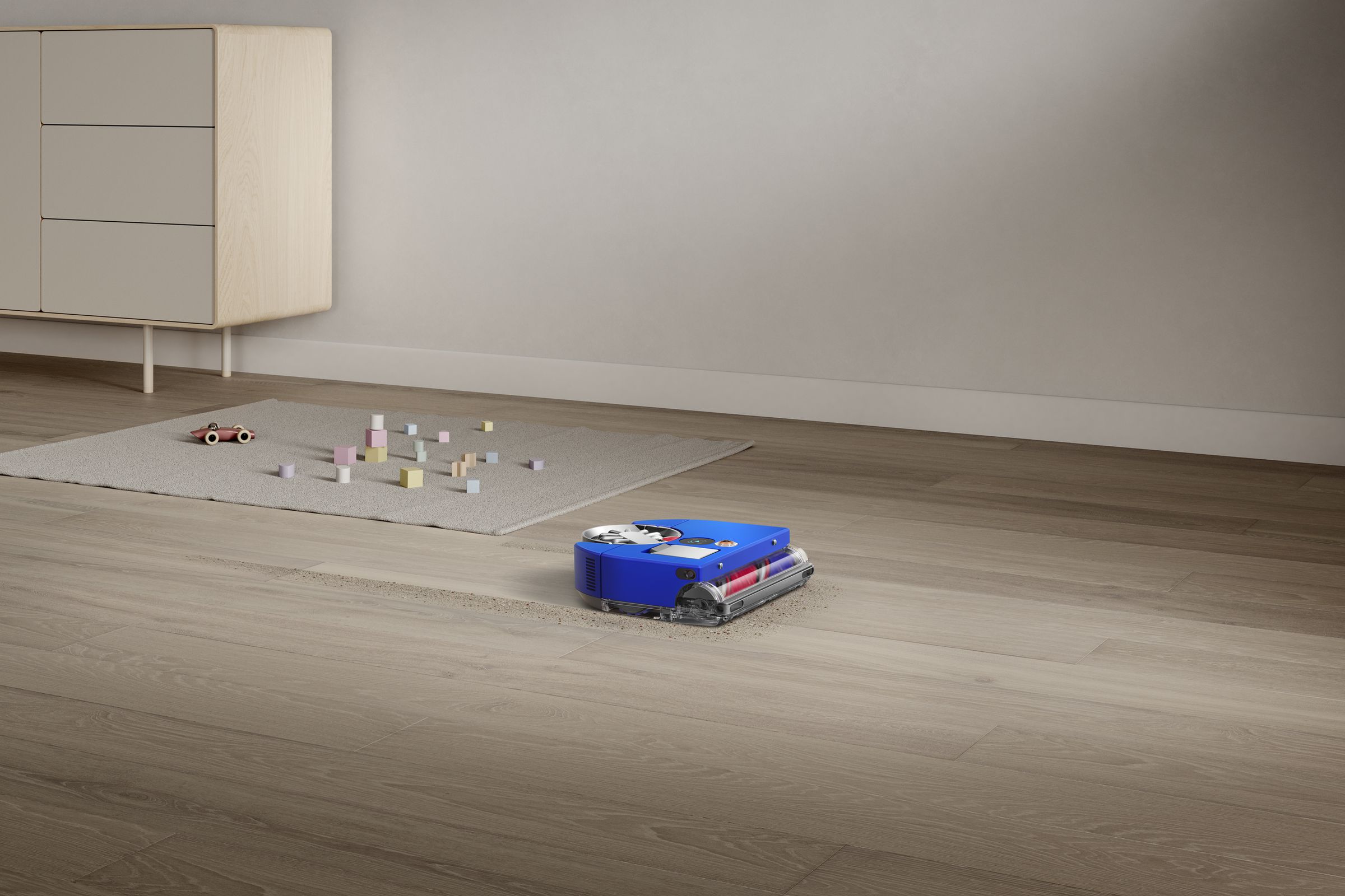 A blue robot vacuum on the floor of a home.