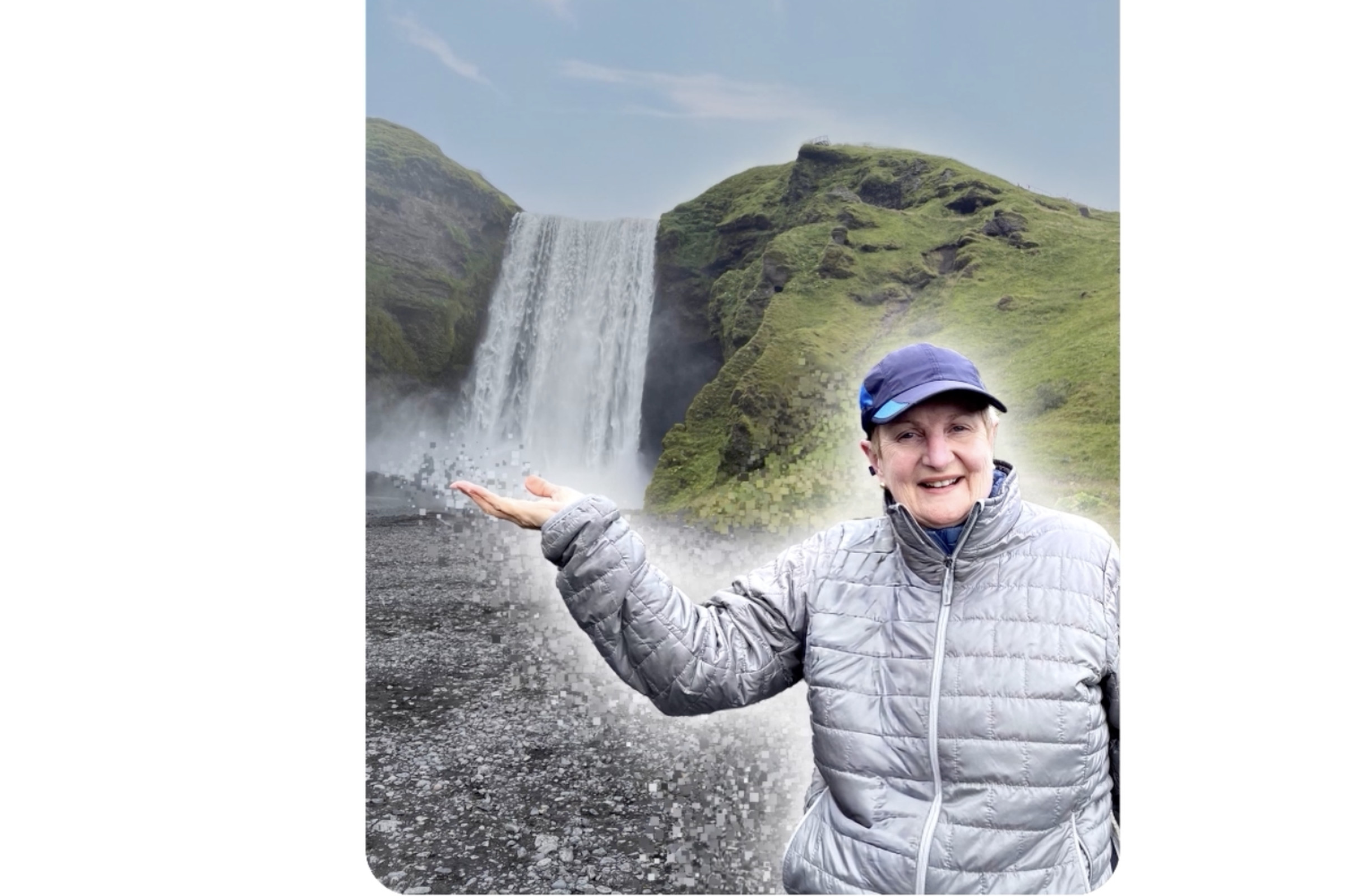 A photo of a woman in front of a waterfall