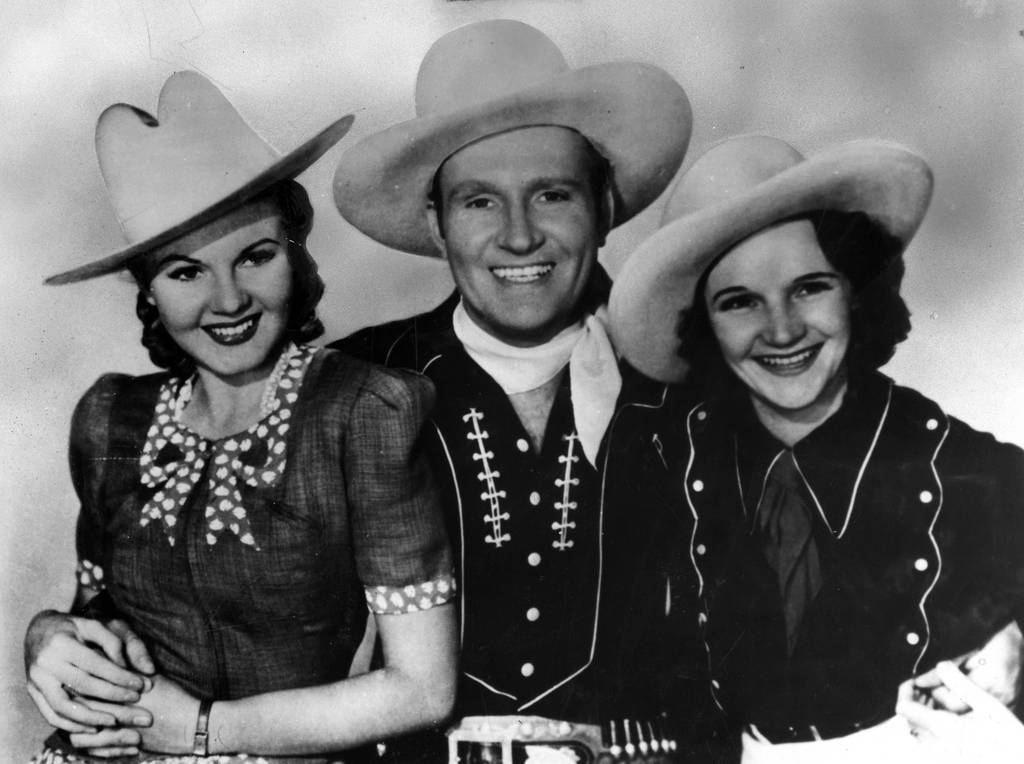 In the 30s and 40s, Chicago was a country music hotspot thanks to the WLS National Barn Dance radio program, which featured June Storey, from left, Gene Autry and Patsy Montana. 