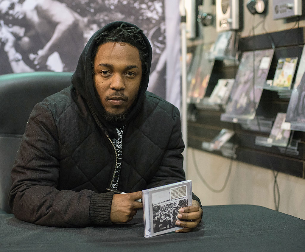 Kendrick Lamar Signs Copies Of His New Album "To Pimp A Butterfly"