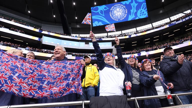 Fans show their support Union Jack flags following the national anthem for the Coronation of Charles III and Camilla prior to the Premier League match between Tottenham Hotspur and Crystal Palace at Tottenham Hotspur Stadium on May 06, 2023 in London, England. (Photo by Tottenham Hotspur FC/Tottenham Hotspur FC via Getty Images)