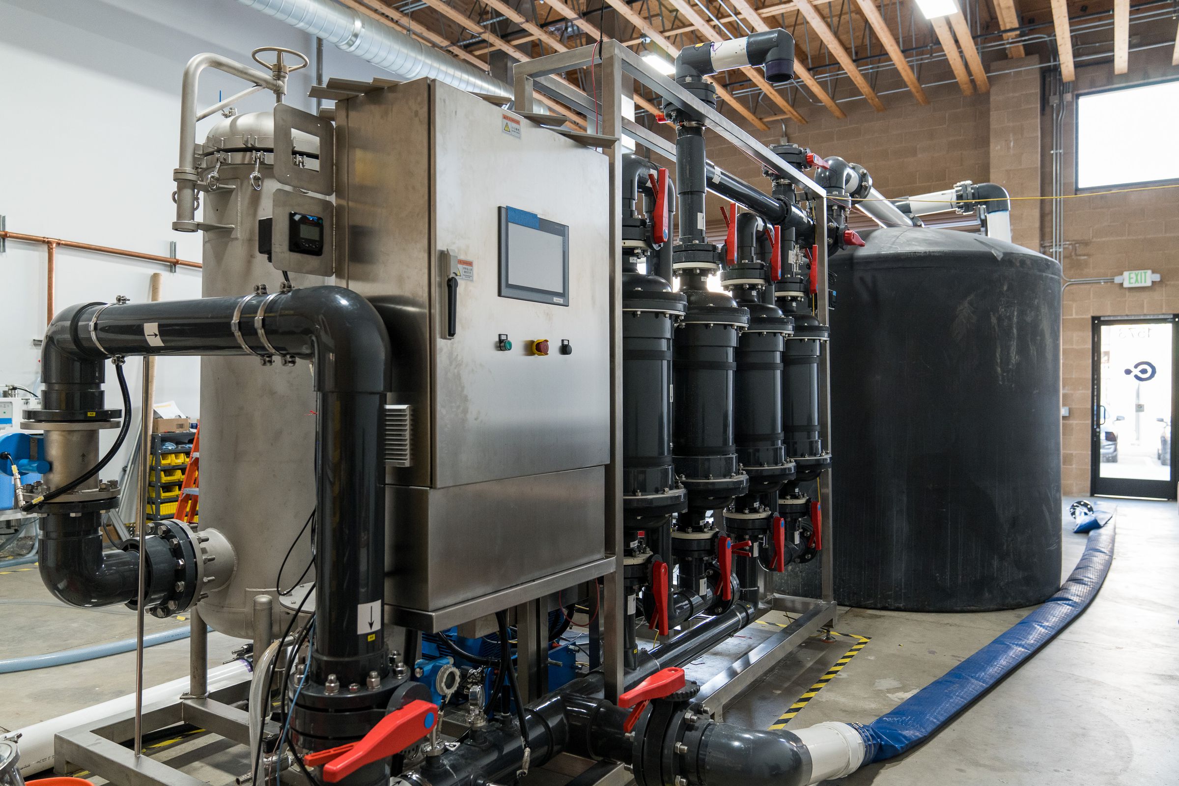 A water tank and pump system with tubing.