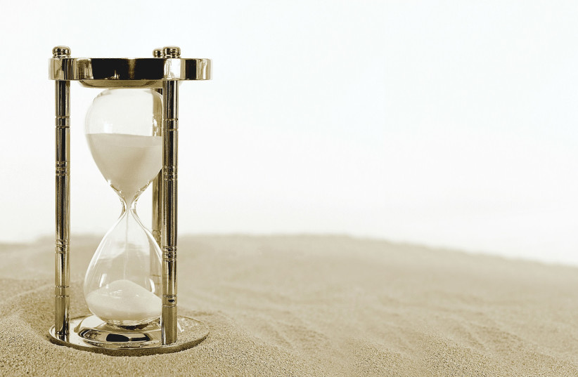  Can our biological sands of time be reversed, rejuvenating us from aging? (Illustrative) (credit: PIXABAY)