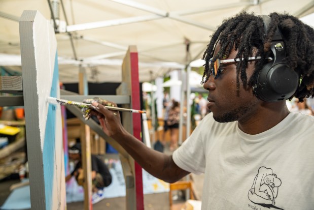 An artist creates a piece at the Boulder Creek Festival, which features artists, live music, kids activities, a craft beer fest and more, May 26-29, 2023. (Ryan James Cox, provided by Boulder Creek Festival)