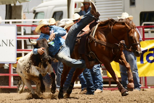 GREELEY, CO - June 29: Stetson Jorgensen is competing steer wrestling during Greeley Stampede at Island Grove Regional Park. June 29, 2019. The event is Colorado's premier western summer celebration and visitors enjoy rodeo, concerts, and foods. (Photo by Hyoung Chang/The Denver Post)