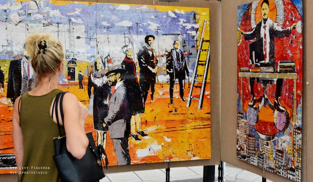 A woman looks at works by Daryl Thetford at the Cherry Creek Arts Festival in Denver in 2016. This year's festival is July 1-3. (Liz Levy, provided by Cherry Creek Arts Festival)